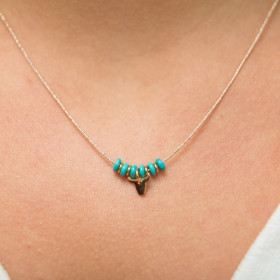 collier turquoise et tête de bufle